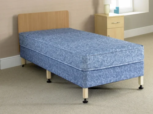 A bed with six legs, a wood headboard and blue mattress.