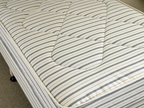 A close-up of a stripy mattress.